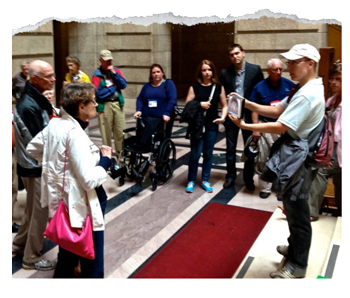 Kristen explains the history of the Manitoba Legislature to a group of seniors